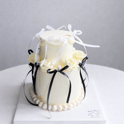 Chic Ivory Bow Cake